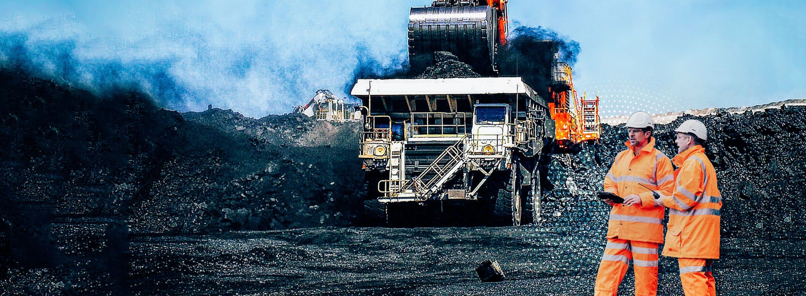 workers in front of earth mover