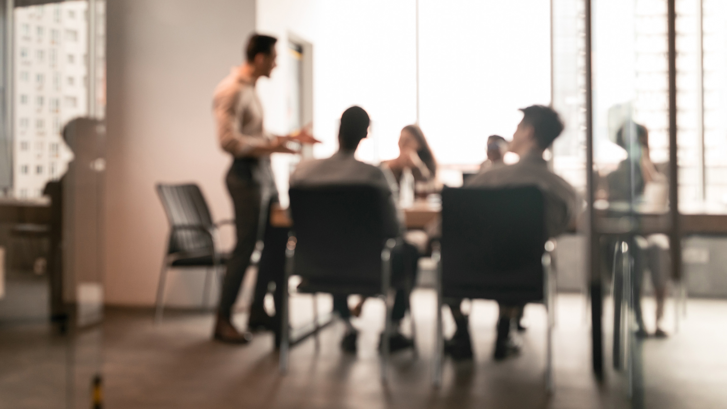 Professionals collaborating in a modern conference room.